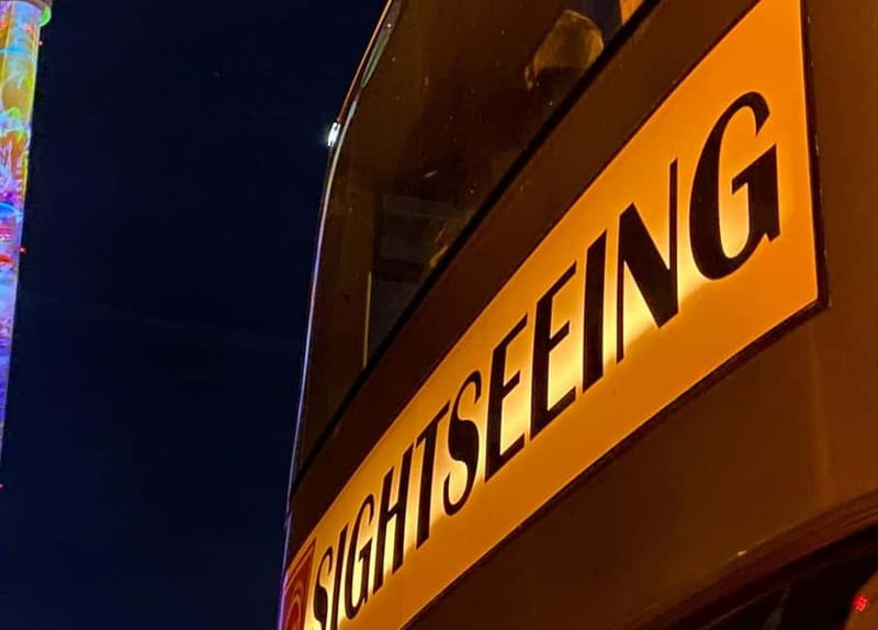 Berlin: Bus Tour by Night with Live Commentary - Upper deck views, cold air, and rain